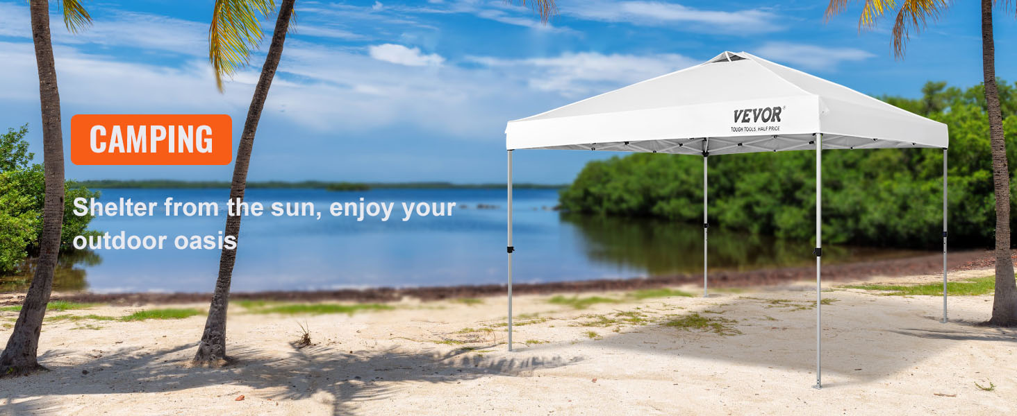 VEVOR pop up canopy tent on a sandy beach with palm trees and a serene lake in the background.