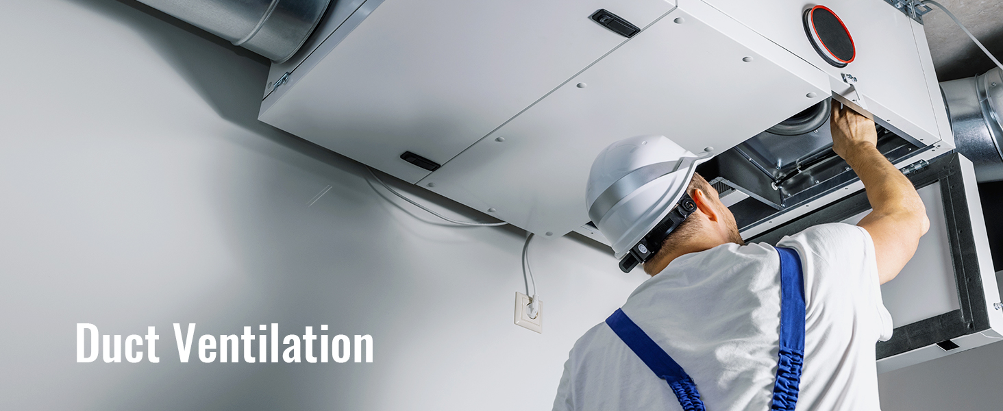 technician inspecting hvac duct ventilation system in a building.