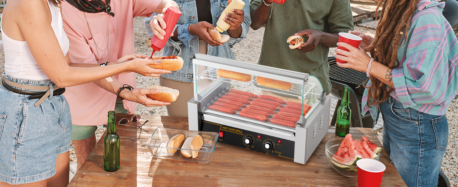 friends enjoying a backyard bbq with a VEVOR hot dog roller, hot dogs, rolls, and condiments on the table.